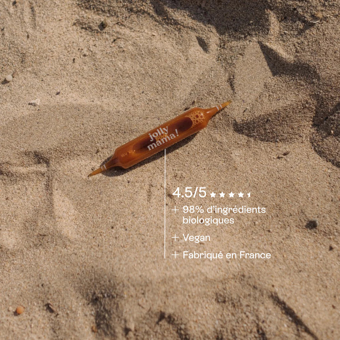 Ampoule Light Legs Jolly Mama posée sur le sable, mise en avant du côté naturel et estival de la cure.
