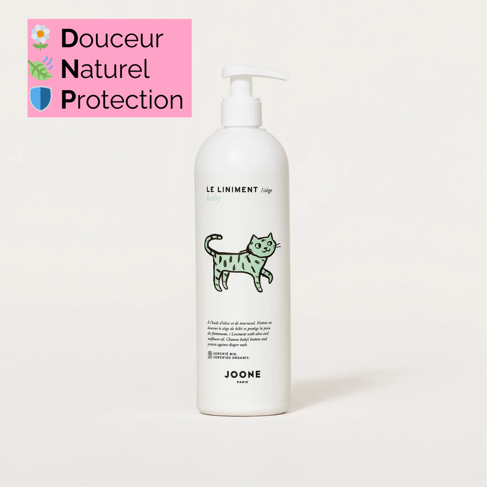 Flacon de liniment de JOONE sur fond rose, mettant en avant son aspect naturel et son engagement écoresponsable. Produit 100% d'origine naturelle